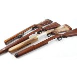 Four various rifle stocks