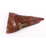 A good tan leather pistol holster, with additional magazine and cleaning rod pockets, to suit