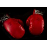 Muhammed Ali, a pair of boxing gloves both with signatures, that have been verified by an expert,