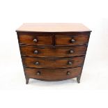 A 19th Century bow fronted mahogany chest of drawers, having two short over three graduated long