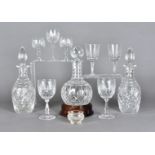 A collection of cut glass, including a pair of decanters and stoppers, a port decanter and stopper