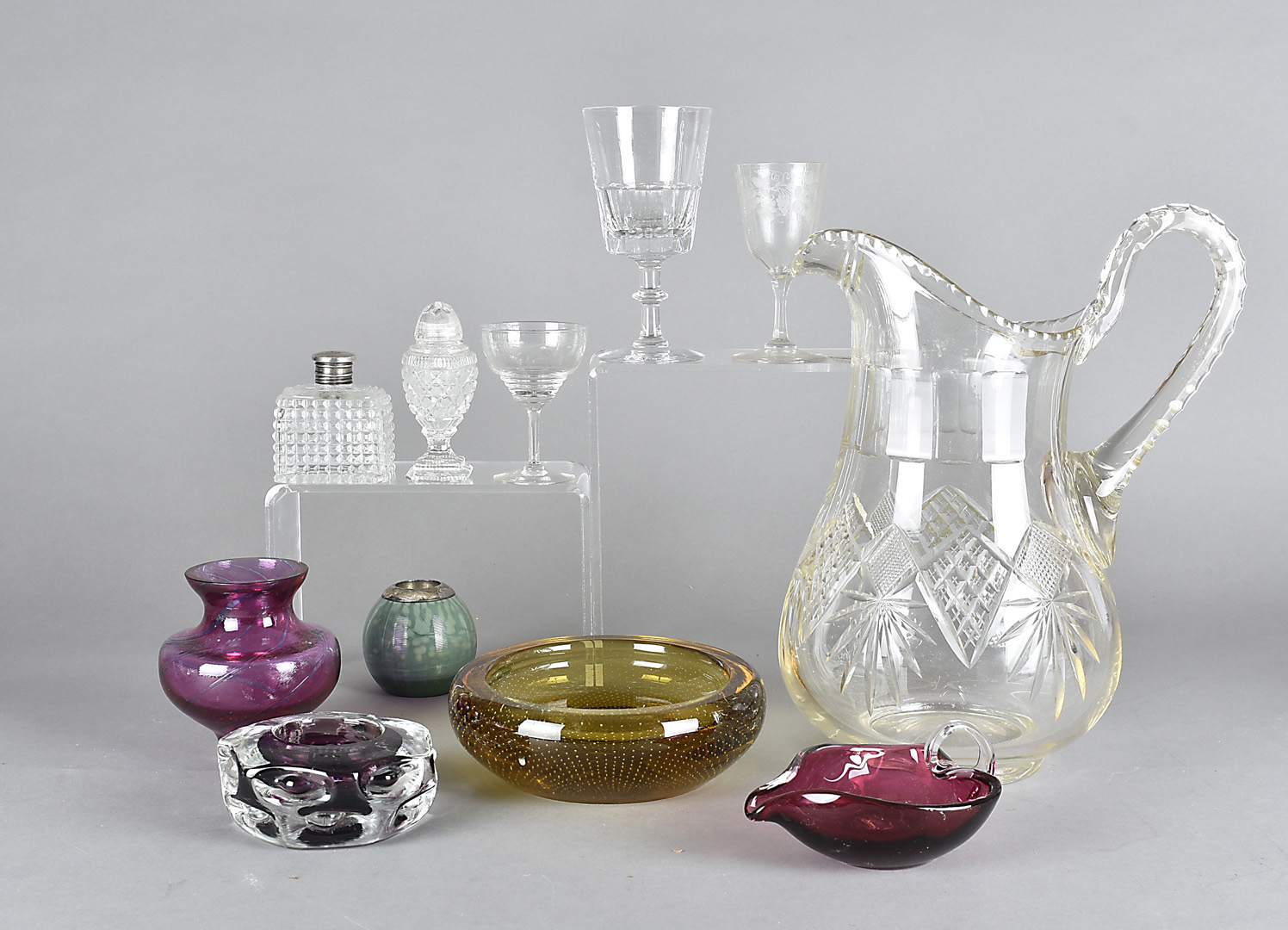 A large cut glass jug, af, together with a quantity of other coloured and clear glassware