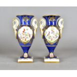 A pair of 1950s French porcelain vases, the twin handled vases having blue ground, with hand painted