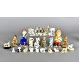 A quantity of Wade whimsies and figures, including a Bisto children salt and pepper, pen rests and