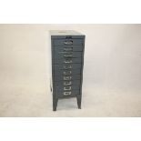 A narrow aluminium filing cabinet, having ten drawers on splayed feet, by Mitre-Plan, 28 cm wide x