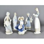 Four Lladro figures, all modelled as girls and a Nao example of a washer girl (5)