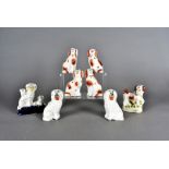 A collection of three pairs of small Staffordshire spaniels, largest 10.5 cm high, together with a