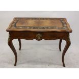 A 19th Century walnut and kingwood inlaid card table, having shaped top with ormolu mounts to