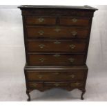 A 19th Century mahogany and walnut crossbanded chest on stand, the top having two short over three