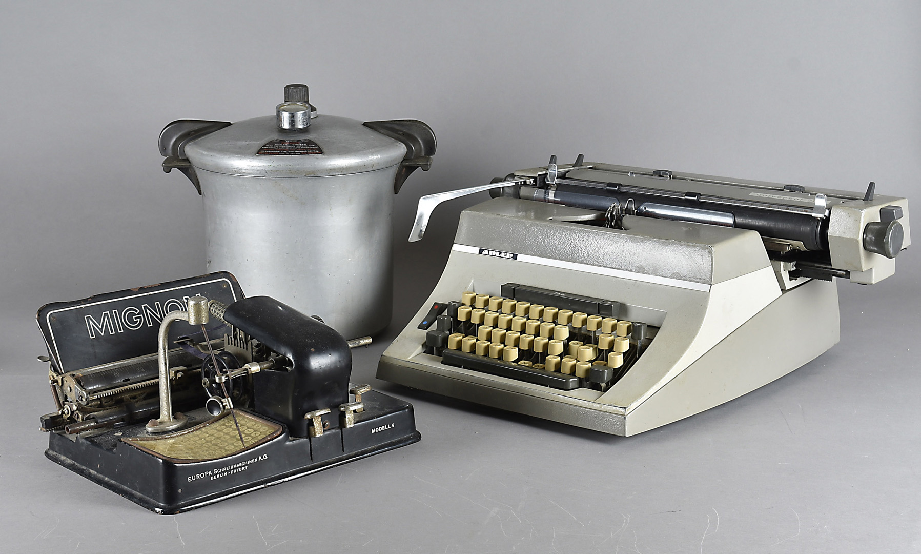 A Universal 200 typewriter, by Adler, together with a Mignon Model 4 Europa Schreibmaschinen and a