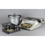 A Universal 200 typewriter, by Adler, together with a Mignon Model 4 Europa Schreibmaschinen and a
