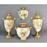 A pair of Doulton Burslem twin handled urns and covers, one af, 33 cm high, together with a pair