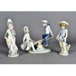 A Lladro figure group, modelled as a girl and boy on a see saw together with two other Lladro