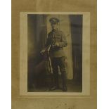 Three WWI black and white photographs, of large size, framed and glazed, depicting a machine gun