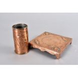 A Newlyn copper arts and crafts teapot stand, of square shape with embossed corners of shells and