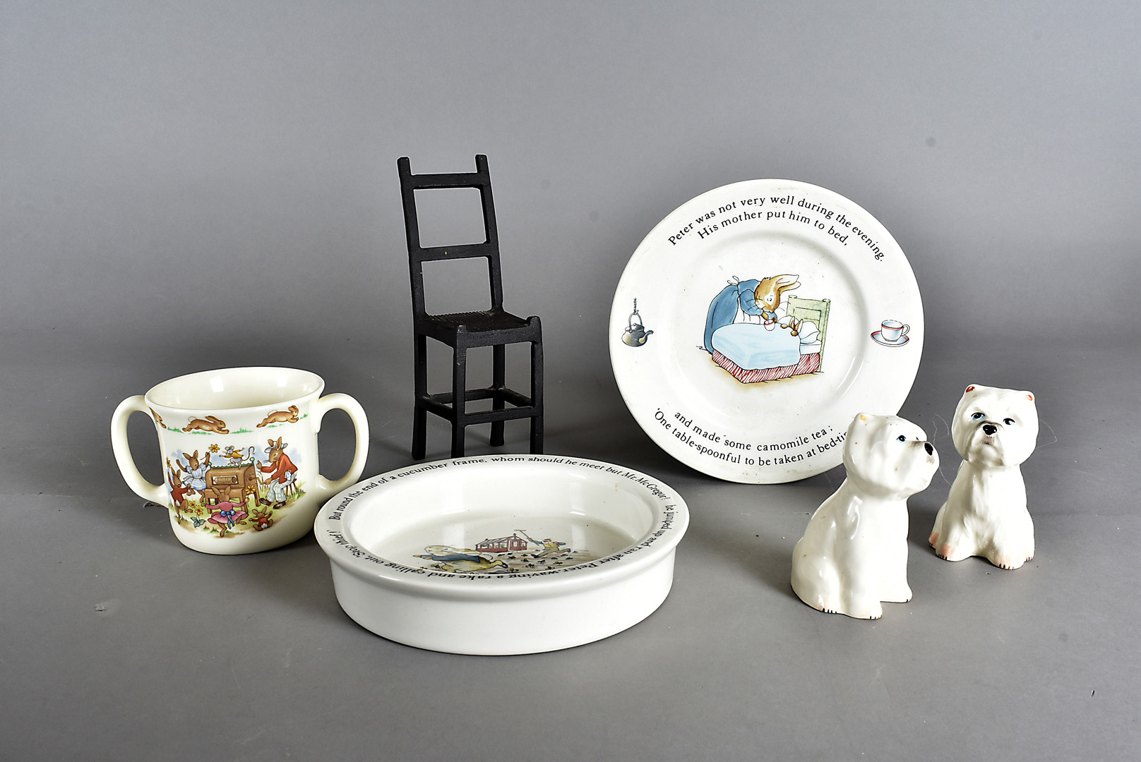 Two Wedgwood Peter Rabbit baby plates, together with a Bunnykins twin handled mug, a pair of