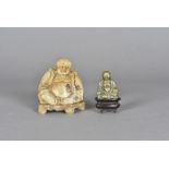 A 19th Century Chinese soapstone Buddha, 10.5 cm high together with a brass example on hardwood