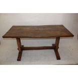 A rustic oak three plank top table, of rectangular form with central stretcher, 161 cm x 78 cm