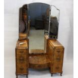 An art deco walnut triptych dressing table, having central full length mirror over drawer flanked by