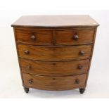 A 19th Century mahogany bow fronted chest of drawers, having two short over three graduated long