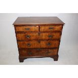 A Georgian flat fronted chest of drawers, walnut veneered with mahogany crossbanding, two short over