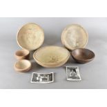 A collection of six turned oak bowls, by G W Laily with two postcards of the artist