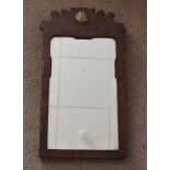 A 19th Century mahogany veneered fret carved mirror, 56 cm x 32 cm