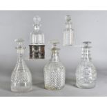 A group of five cut glass decanters and stoppers, all of various shape and design, together with a