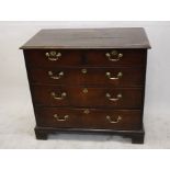 A country oak chest of drawers, two short over three long drawers on bracket feet, 96 cm wide x 87