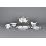 An Aynsely six place tea set, decorated with bluebird flying amongst a yellow blossoming tree branch
