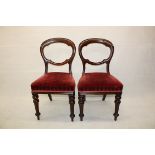 A matched set of twelve 19th Century balloon back dining chairs, together with a D end mahogany twin