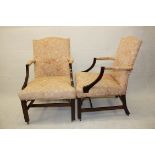 A pair of upholstered mahogany framed armchairs, supported on straight legs, castors with pink