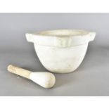 A large marble pestle and mortar, of circular form with four protruding demi lunes, 34 cm diameter x