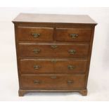 A 19th Century oak chest of drawers, two short over three long drawers, bracket feet, brass handles,