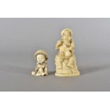 A 19th Century Japanese Okimono, the ivory carved figure modelled seated as a drunken man with a