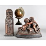 A wooden Monk wine bottle case, together with a plaster figure of 18th Century cupids kissing plus a