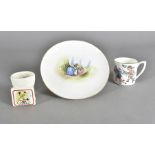 A Grimwades pottery Peter Rabbit side plate, transfer printed scene of Peter, his sisters and his