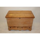 A pine blanket box, with two base drawers, hinged lid, shaped apron, bracket feet, 97 cm x 66 cm