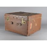 An Edwardian canvas and leather travelling trunk, with fitted shelf and a WWII scrap album of