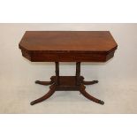 A William IV mahogany and ebony strung card table, the rectangular top with canted corners with