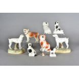 A pair of Staffordshire figures, modelled as Dalmatians, both having damaged tails together with a