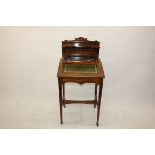 An Edwardian rosewood satin and boxwood inlaid bonheur du jour, with hinged leather top, galleried