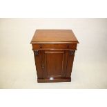 A 19th Century mahogany washstand, with lift top over cupboard base, 62 cm x 85 cm high x 45 cm