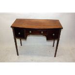 A mahogany lady's side table, with single frieze drawer flanked by two deep short drawers, 95 cm x