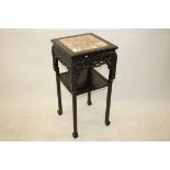 A 19th Century Chinese hardwood and marble topped plant stand, of square form with carved frieze