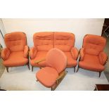 An Ercol Windsor hoop back beech three piece suite, together with a matching rocking chair (4)