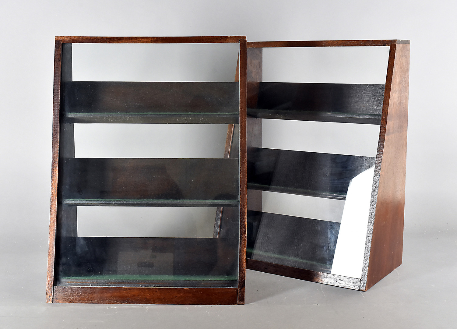 A pair of stained oak glass fronted table top display cabinets, fitted with three shelves and open