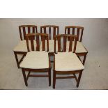 A set of five Heales and Sons oak dining chairs, having ivorine label to underside (5)