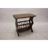 An Ercol canterbury, with rectangular top over rack base, 55 cm x 36.5 cm x 51 cm high