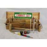 A Jacques lawn croquet set, in pine box comprising four mallets, six hoops, four balls, together